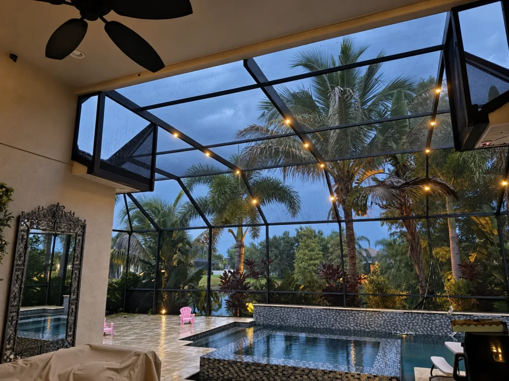 Warm lighting along a PAZ screen enclosure at dusk
