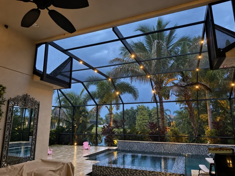 Warm lighting along a PAZ screen enclosure at dusk